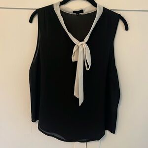 ontwelfth black tunic blouse with white bow